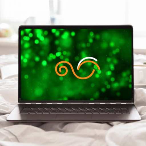 Laptop with green sparklies and Autscape logo